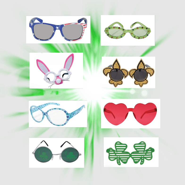 Colorful novelty glasses on green background.